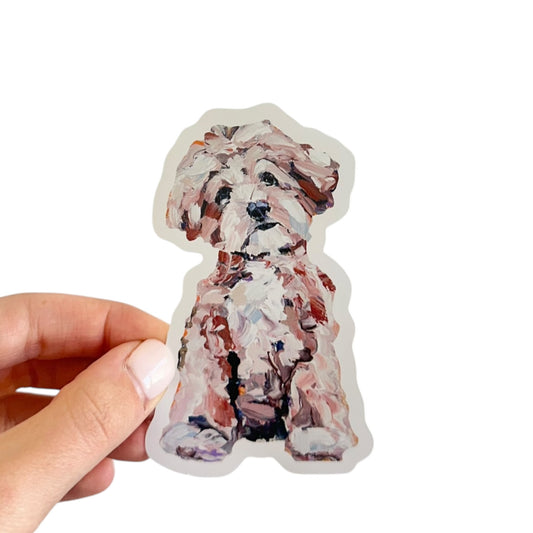 An apricot Malitpoo dog vinyl removable sticker featuring artwork y Chelsea McShane. 