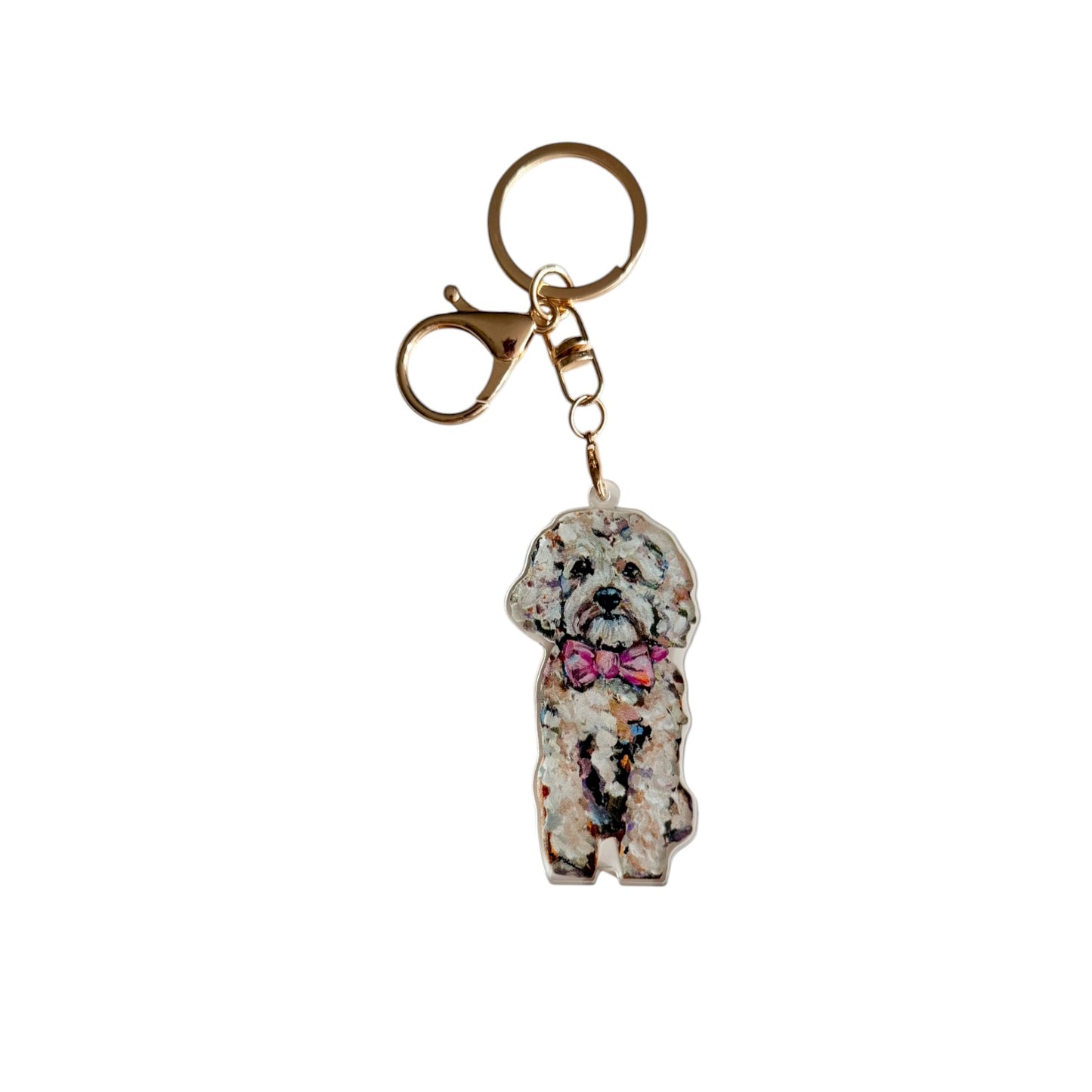 Cavapoo acrylic dog bag charm and keychain featuring artwork by Chelsea McShane.