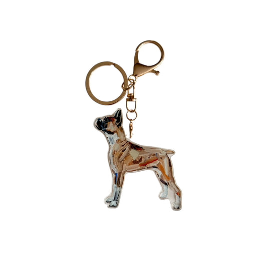 Boxer acrylic dog bag charm and keychain featuring artwork by Chelsea McShane.