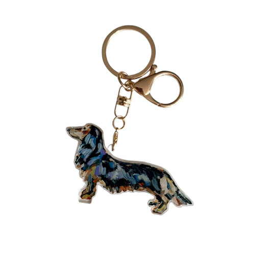 Dachshund acrylic dog bag charm and keychain featuring artwork by Chelsea McShane.