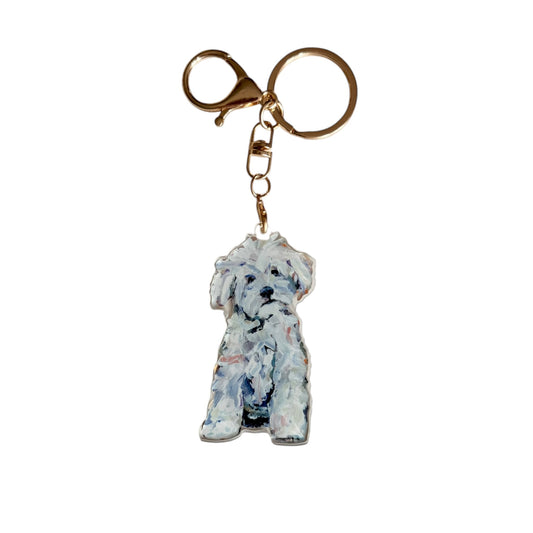 White Maltipoo acrylic dog bag charm and keychain featuring artwork by Chelsea McShane.