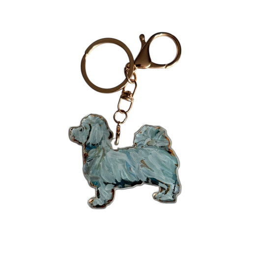 Maltese acrylic dog bag charm and keychain featuring artwork by Chelsea McShane.