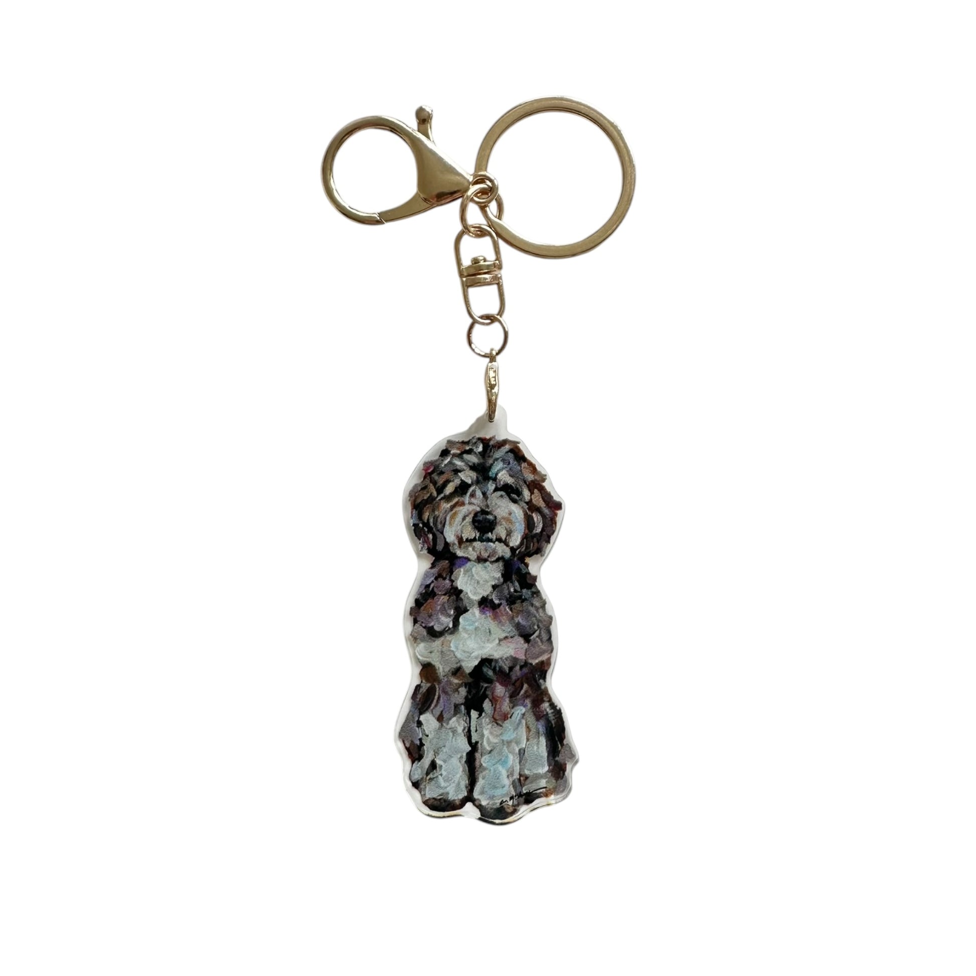 Bernedoodle acrylic dog bag charm and keychain featuring artwork by Chelsea McShane.